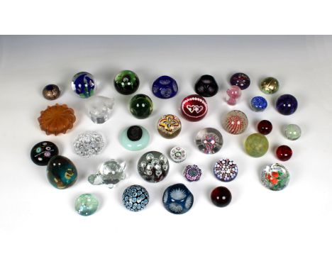 A collection of glass paperweights by Caithness, Whitefriars, Medina, Webb and other makers, including a frosted bear (Goebel