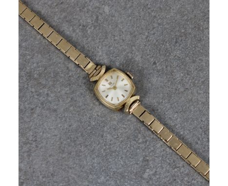 A ladies gold Tissot wrist watch the small convex sided square face with baton hour markers on 9ct gold bracelet, together wi