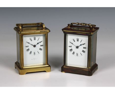 Two brass carriage clocks both with white enamel dials and Roman numerals, one inscribed on the dial "Jays 142 &amp; 144 Oxfo
