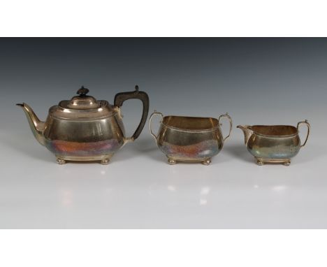 A three piece silver tea service Harrison Brothers &amp; Howson, Sheffield, 1919, of oval bellied form, comprising of teapot,