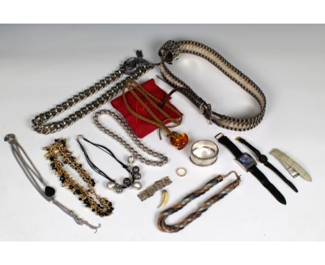 A collection of costume jewellery to include a late 19th/early 20th century white metal aesthetic movement hinged bangle with