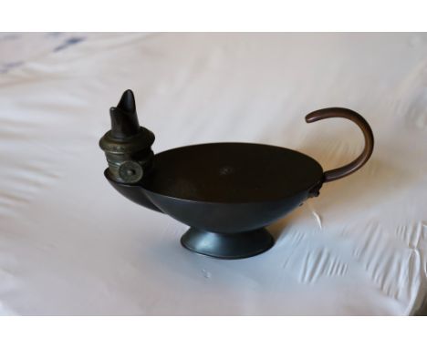 A small copper Aladdin’s lamp by Kenyon, Manchester Rd. 93900, 7in. (17.8cm.) long, 4¼in. (11.4cm.) high. *Needs cleaning, go