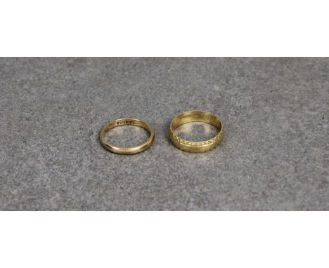 Two 18ct yellow gold rings one of plain form, size K, the other a band with bright cut rims, inscribed to inner. (2) * Weight