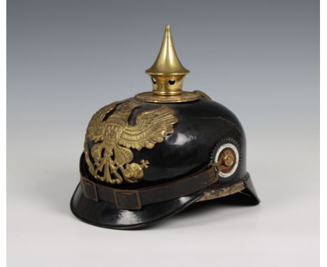 A World War I Imperial German Prussian Infantry pickelhaube mounted with brass eagle helmet plate.