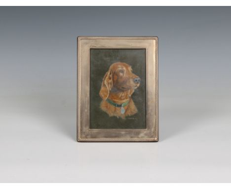 A small plain silver photo frame with a watercolour of a dog by Kevin Hickman signed lower right 'K. Hickman 06', 5 x 3½in. (