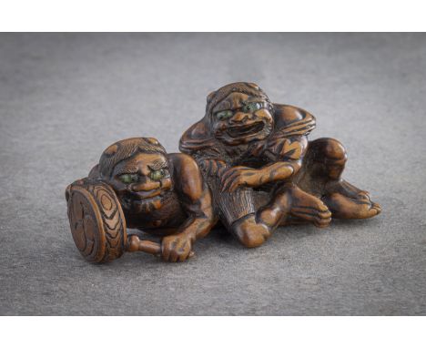 A RARE WOOD NETSUKE OF RAIJIN AND FUTEN Unsigned, Japan, 19th century, Edo period (1615-1868) An amusing and unusual wood net