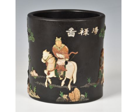 A Chinese inlaid black lacquer brush pot probably late 19th or early 20th century, inlaid and applied around exterior with va