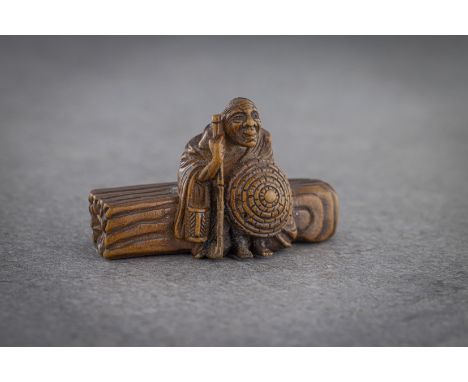 A WOOD NETSUKE OF SOTOBA KOMACHI (depicted as an old hag) Signed probably Shungetsu, Japan, early 19th century, Edo period (1