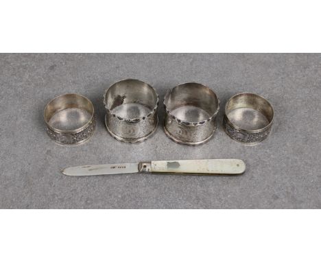 Two pairs of silver napkin rings together with a silver bladed penknife, engraved mother of pearl handle, in original case 'R