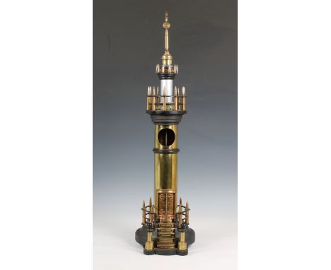 A large trench art lighthouse made with shells and bullets, the centre with turning cog and mechanism for light or watch, 31i