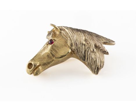 Equestrian interest - A 9ct yellow gold brooch cast as a horses head, with a ruby set eye, total gross weight approx 9.9g. *g