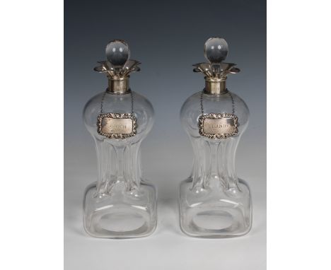 A pair of Edwardian silver mounted Glug-Glug decanters Grey &amp; Co, Birmingham, 1909, of typical rounded square form with f