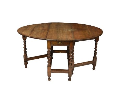 with two demi lune drop leaves over a single frieze drawer, (alterations to top), supported by four fixed barley twist legs t