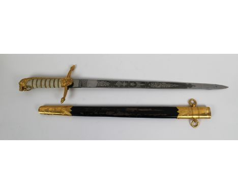 An early 19th century Royal Naval Midshipman's dirk and scabbard the blade etched with scrolling foliage and inscribed "SEAGR