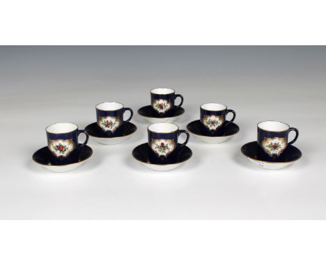 A set of six Royal Worcester blue fish scale coffee cans with matching saucers, each with a central panel of a painted insect