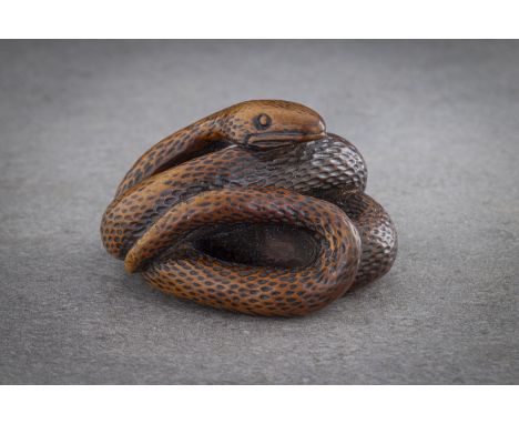 AN EXCEPTIONAL AND LARGE WOOD NETSUKE OF A SNAKE Unsigned, Kyoto school, circa 1780 A remarkably bulky and powerfully execute
