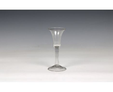 An 18th century wine glass waisted bell shape bowl, slightly domed foot, pontil beneath, 6¼in. high. * No chips or carcks, li