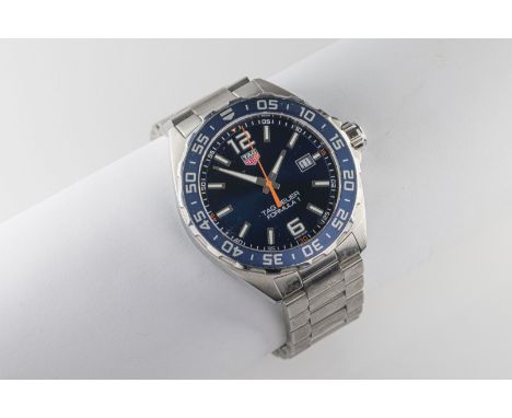 A gentleman's stainless steel Tag Heuer Formula 1 wristwatch the 33mm circular blue dial with illuminating Arabic 12,6 and ba