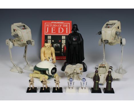STARWARS vintage collectables from the '80s and '90s to include 2 loose vintage ATST, a vintage Wompa and a copy of STARWARS 