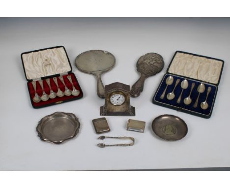 A collection of silver to include a nice dressing table clock with silver case, Henry Matthews, Chester, 1913, 3½in. (8.8cm.)