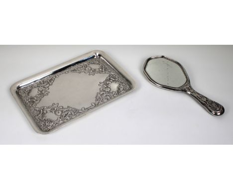 An Art Nouveau silver rectangular dressing table tray each corner embossed with flowers and foliage, vacant cartouche, 31cm x