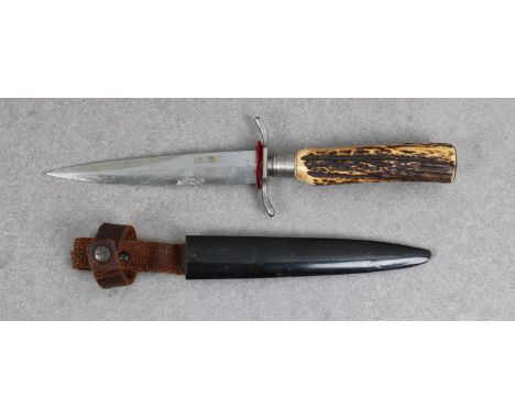 A WWI German trench knife the double edged blade 5¾in. steel blade marked 'engels werk solingen-foche', 'S@ shaped cross guar