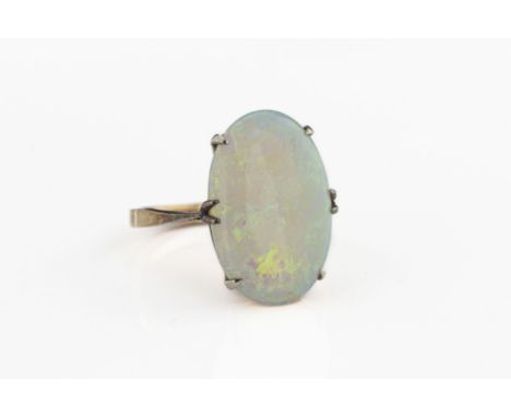 A 9ct yellow gold and opal ring the oval cabochon opal approx 17.6mm x 11.6mm x 3.09mm, claw settings, ring size K, total gro