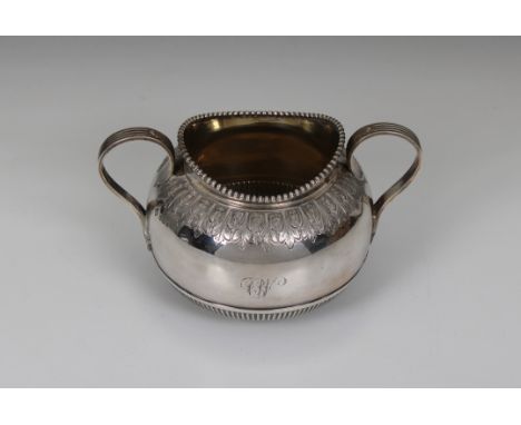 A silver sugar basin Martin, Hall &amp; Co, Sheffield, 1894, of bellied twin handle form with reeded detail and foliate trim,