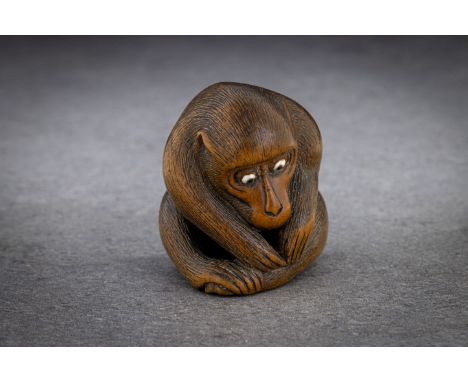 A WOOD NETSUKE OF A MONKEY PICKING FLEAS Signed Koichi, japan, second half of 19th century Finely carved as a seated, large-h