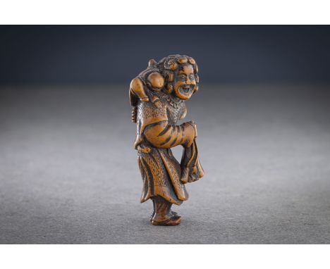 A WOOD NETSUKE OF A DUTCHMAN WITH CHILD Unsigned, Japan, 18th century, Edo period (1615-1868) Typically depicted with shoulde