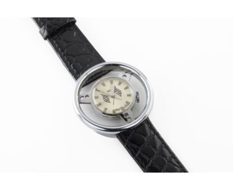 A vintage GT novelty steering wheel watch the circular dial with illuminating hands and baton indicators, with crossed checke