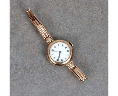 A ladies 9ct gold cased wrist watch on an expanding "gate-link" bracelet, the circular enamel dial with Roman numerals and gi