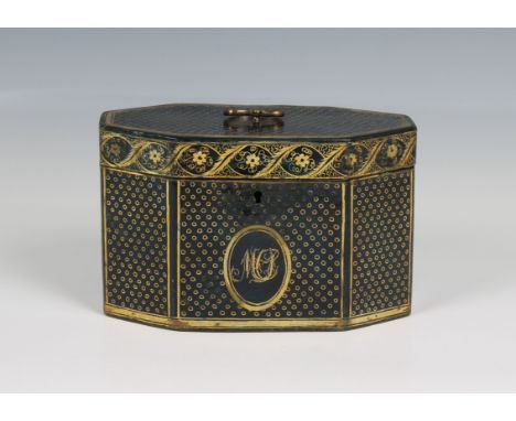 A George III black lacquered and gilt octagonal tea caddy containing two lidded compartments with brass urn finials and brass