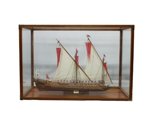 Model of the French galley "Reale de France 1670" 20th century, in a wooden framed glass case, 40 x 25in. (101.6 x 63.5cm.). 