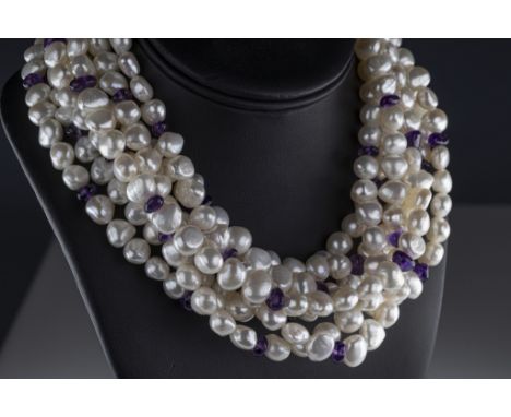 A silver cultured pearl and amethyst seven strand choker necklace the 10mm potato pearls having polished amethyst spacers, si