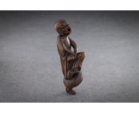 A GOOD WOOD NETSUKE OF A SENNIN (immortal or sage) STANDING ON ONE LEG Signed Keisai, Japan, 18th century, Edo period (1615-1