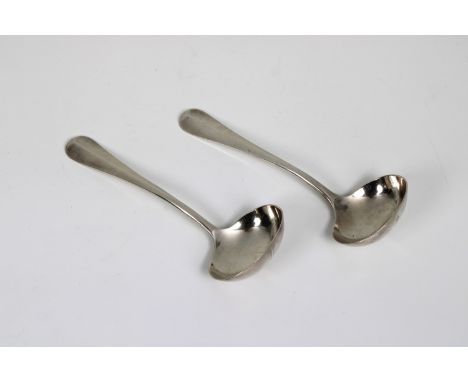 A pair of silver sauce ladles London, 20th century, 6 7/8in. (17.5cm.) long, weight 5.1 tr.oz. (2) * Light surface scratches 