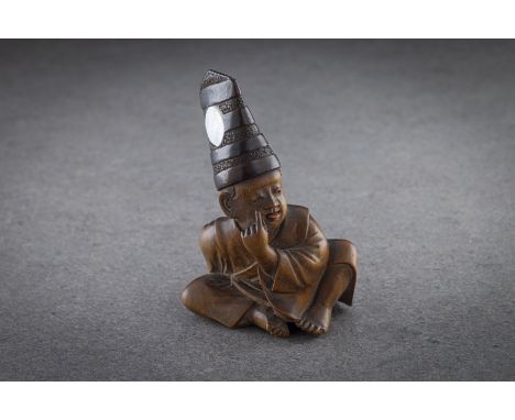 A GOOD LARGE WOOD NETSUKE OF A SITTING ACTOR WITH MOVING PROTRUDING TONGUE Unsigned, probably mid 19th century Well carved in
