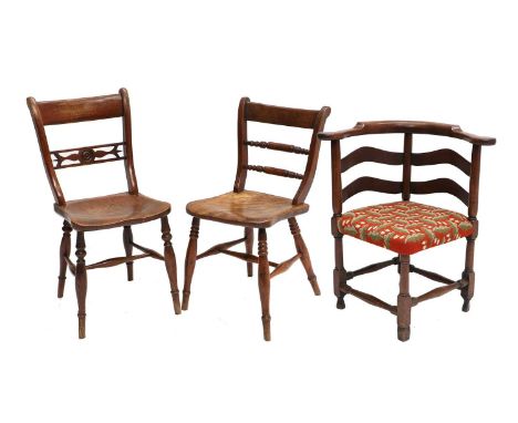 A George III Mahogany Corner Chair, late 18th century, recovered in modern acorn and leaf needlework fabric, the curved back 