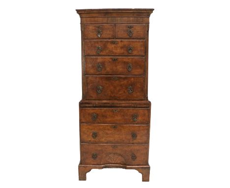 An Early 20th Century Walnut Straight-Front Chest on Chest, the moulded cornice above two short and three long drawers all be