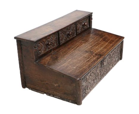 A 17th Century Oak Table Box, dated 1668 and initialled GF, of nulled construction, the superstructure with three carved draw