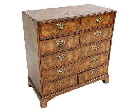 A Walnut, Crossbanded and Boxwood-Strung Straight-Front Chest of Drawers, the quarter-veneered and crossbanded top above ten 