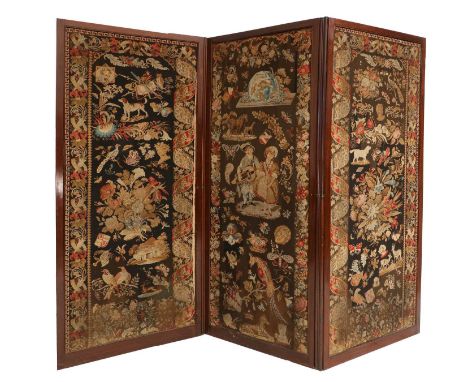 A Victorian Mahogany-Framed Three-Leaf Dressing Screen, late 19th century, covered in later floral needlework, the moulded fr