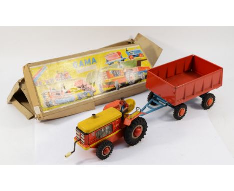 A 1950s Gama tinplate clockwork tractor &amp; trailer, made in Western Germany, boxed, overall length connected 40cm.