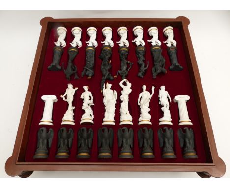 Franklin Mint; 'The Chess set of the Gods' by Stuart Feldman, porcelain mythological pieces, marble playing board housed in f