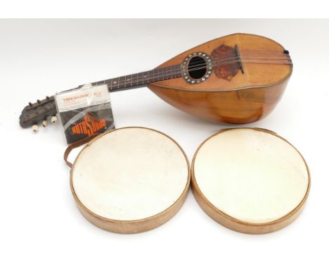 A mid 20th century Italian mandolin, having inset tortoiseshell and mother of pearl decoration, together with a pair of tambo