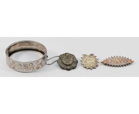 Three Victorian Aesthetic Movement brooches, largest 50mm, together with a Victorian Aesthetic Movement hinged bangle, 55mm, 