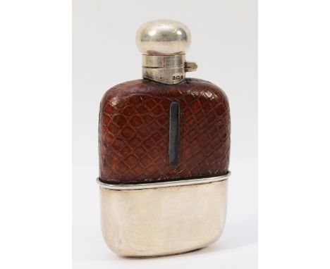 A silver and leather clad hip flask, Birmingham 1932, with bayonet lid, lid stamped Birmingham 1931, 12cm A slight 1cm dent/c