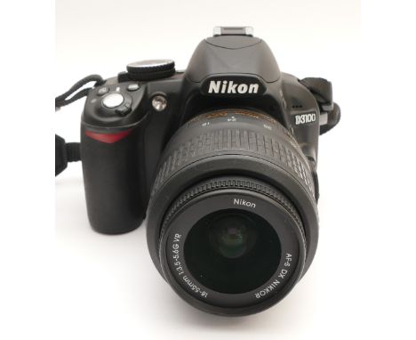 A Nikon D3100 DSLR camera with a Nikon AF-S f/3.5-5.6 18-55mm lens.