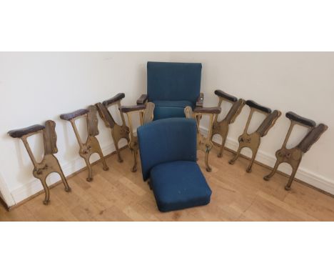 Three sets of five mid 20th century interconnected cinema or theatre seats, cast iron framed with flip-up cushioned seats cur